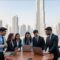 Skyline of Dubai with job seekers in foreground